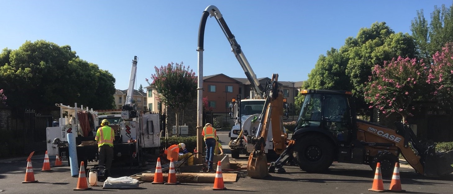 Utility Maintenance staff and equipment working in the street