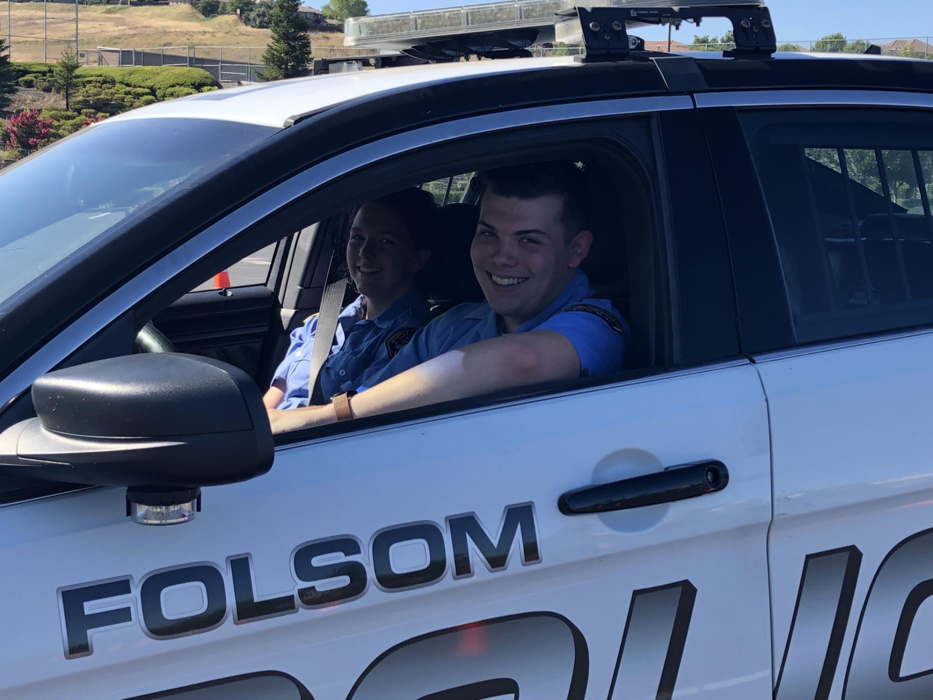 Two Folsom Police Youth Explorers in vehicle during training session