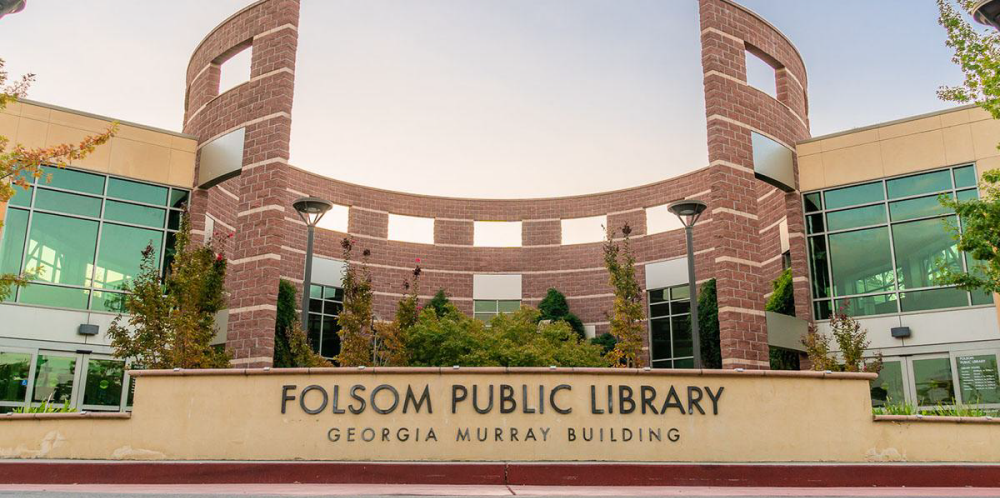 Folsom public library main sign and building exterior photo from a low angle 