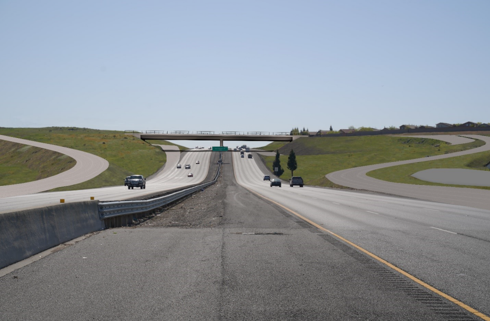 Rendered image of a 2-sided 3 lane freeway with an exit on either side with an overpass in the distance, houses on the right, and a divider in the center of the image