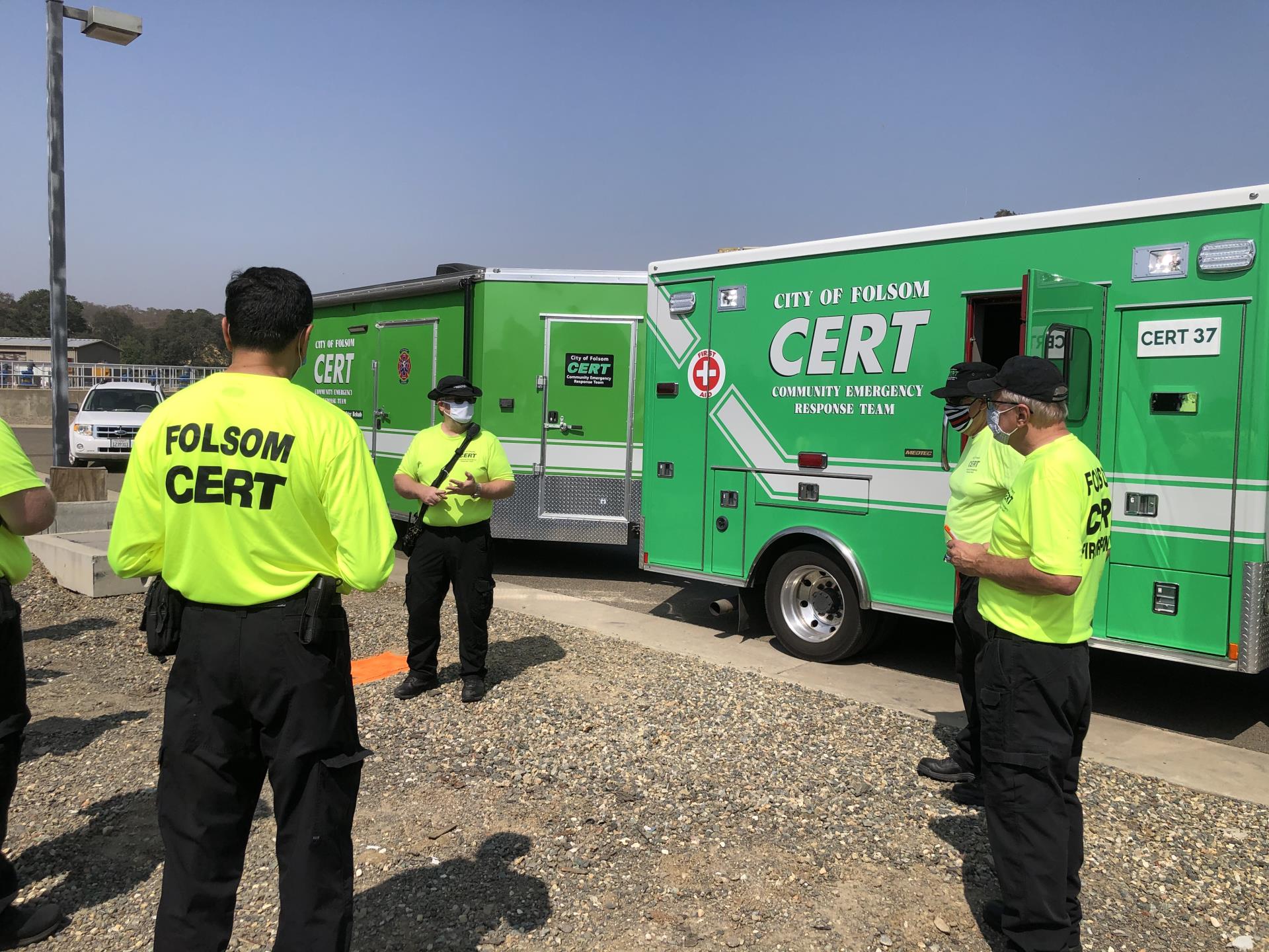 CERT members standing by CERT vehicles