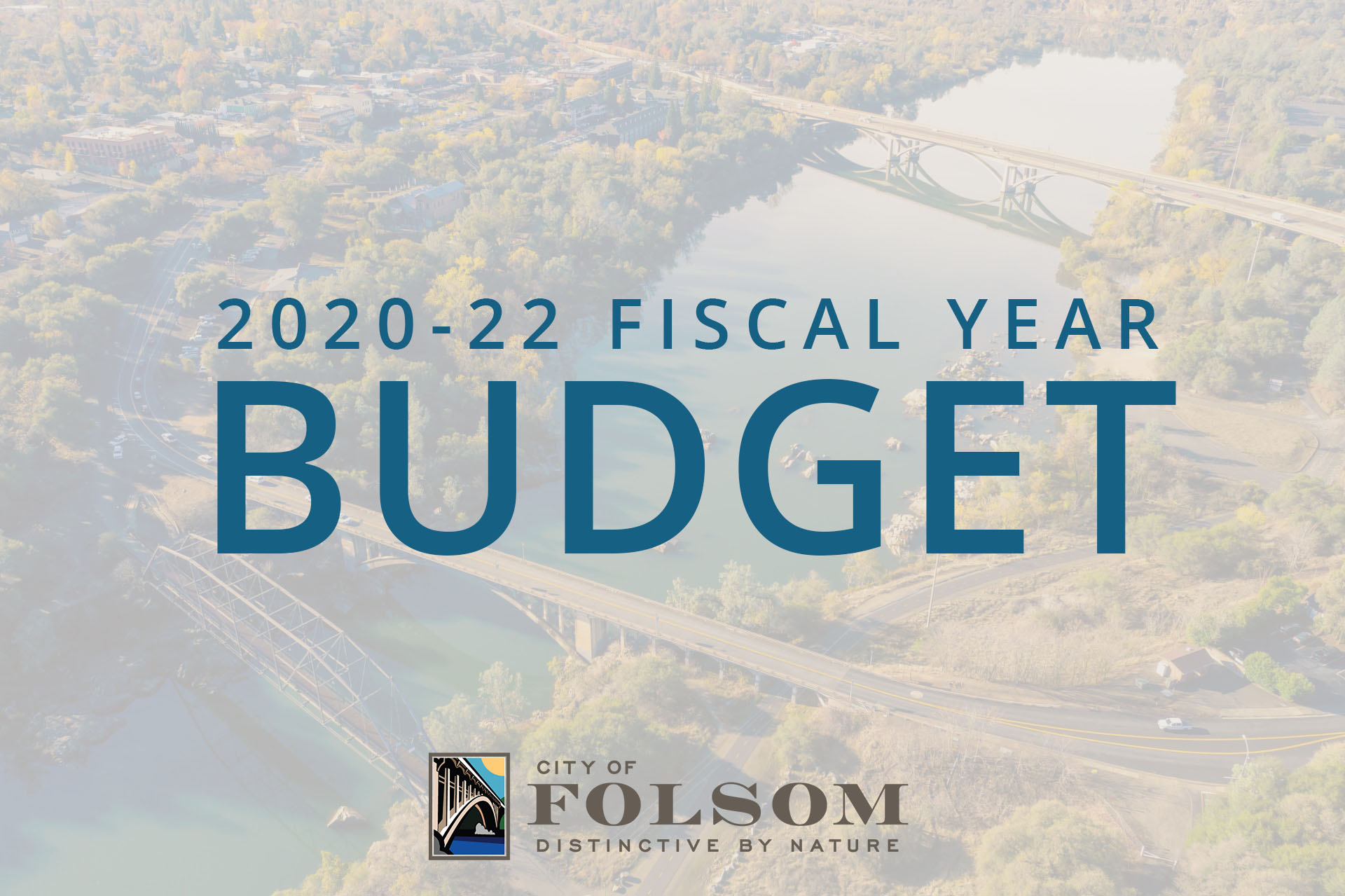 2020-22 Fiscal Year Budget graphic in blue text with a colored city of folsom logo at the bottom, with a white overlay over a picture of Rainbow Bridge and the Historic District aerial shot