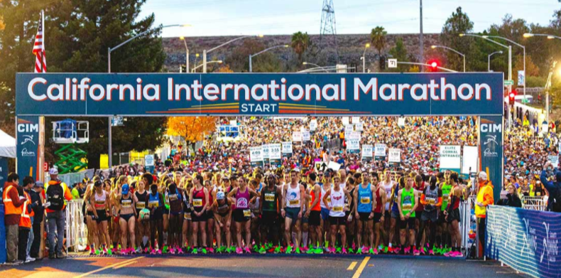 California International Marathon start line with a large group of runners waiting to begin the race