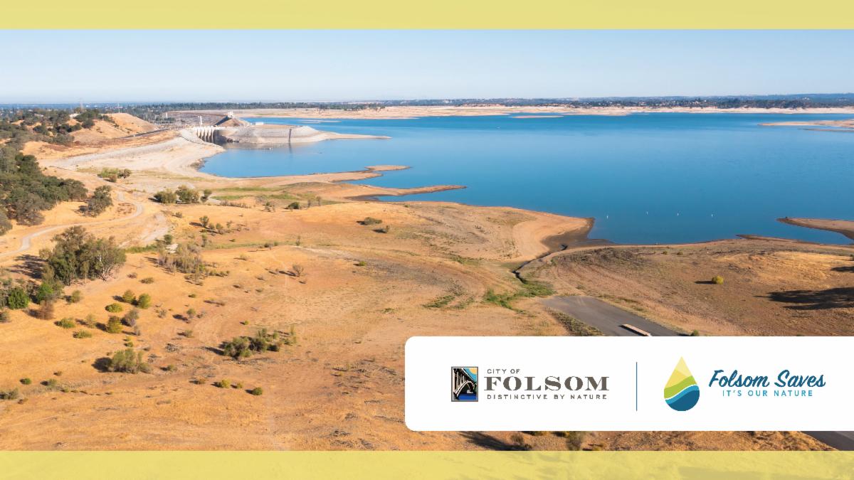 2021 FOLSOM social media post 05 twitter header picture of the lake with the dam to the left in the background, dirt and trees surrounding the lake, and the bright blue lake in the center. city of folsom and folsom saves logo in the bottom right corner