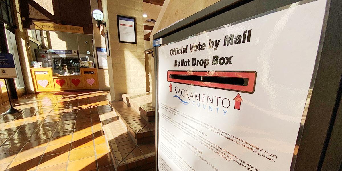 ballot box in city hall with the information desk in the background