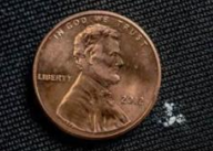 A lethal dose of Fentanyl displayed next to a penny for comparison