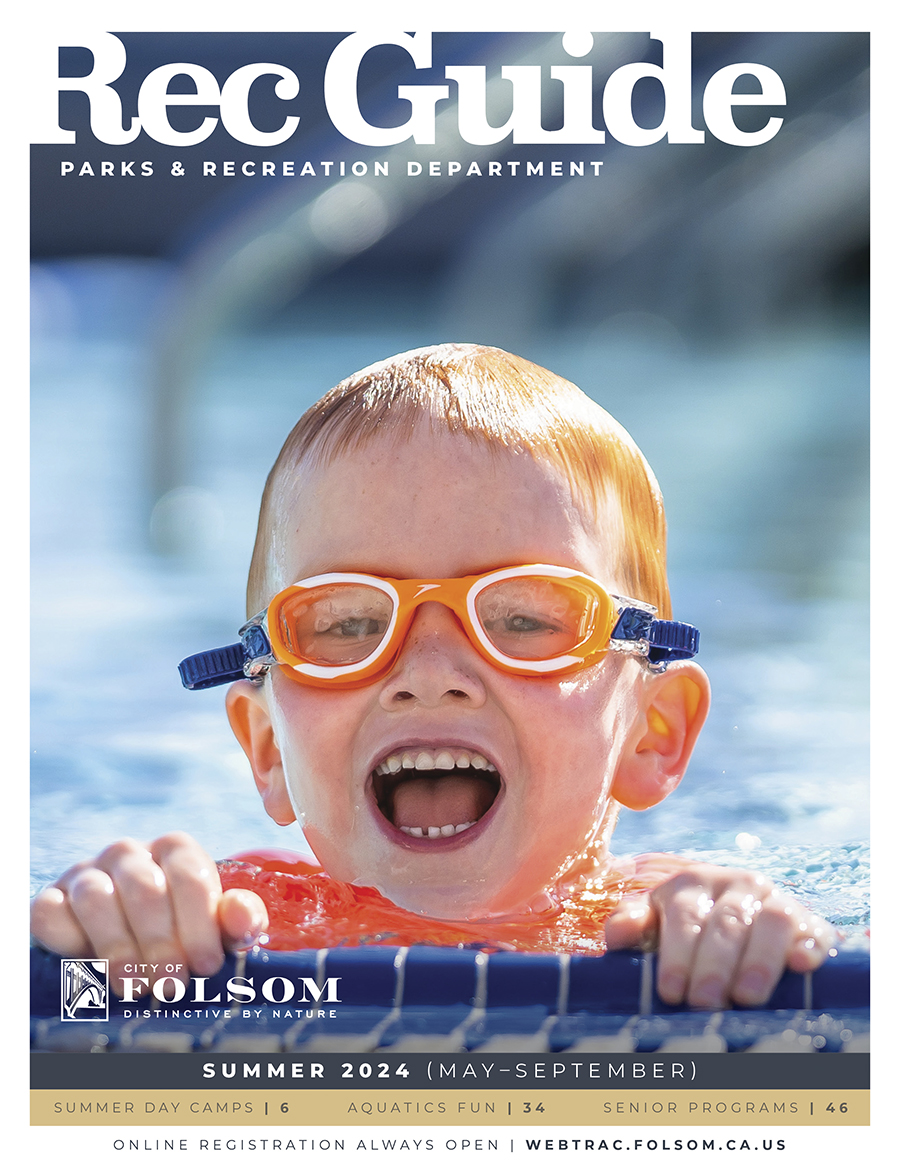 Summer 2024 Rec Guide cover with image of boy wearing swim goggles and splashing at the edge of the pool