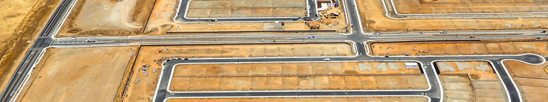 Transportation and Infrastructure header. Aerial image of a large area for construction and transportation.